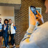 President Mantella taking pictures with families during pancake breakfast.